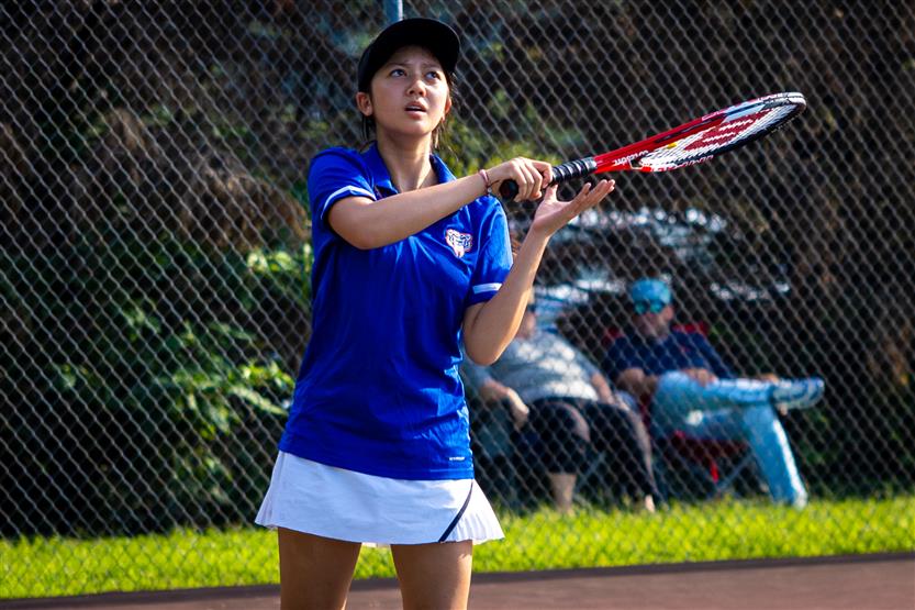 Students play tennis